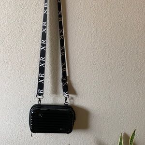 Crossbody bag, mini suitcase.